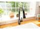 Close-up of kitchen sink with black faucet, wood counters and window with backyard view at 407 Tammie Ave, Goose Creek, SC 29445
