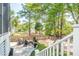 A backyard with a fire pit, lounge chairs, view, and lush mature trees at 4082 Blackmoor St, Mount Pleasant, SC 29466