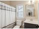 Cozy bathroom features a shower with curtain, a mirror, and a dark vanity at 4082 Blackmoor St, Mount Pleasant, SC 29466