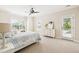 Light-filled bedroom features a bed, dresser, and a door leading to a balcony at 4082 Blackmoor St, Mount Pleasant, SC 29466