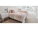 Bright bedroom featuring two twin beds with pink accents, a large window and neutral walls at 4082 Blackmoor St, Mount Pleasant, SC 29466