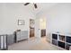 Well-lit bedroom featuring a dresser, storage unit, neutral carpet, and open doorway to the main hall at 4082 Blackmoor St, Mount Pleasant, SC 29466