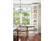 Charming breakfast nook bathed in natural light with views of the outdoors and built in shelving at 4082 Blackmoor St, Mount Pleasant, SC 29466
