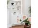 Built-in shelving next to the fireplace with modern decor at 4082 Blackmoor St, Mount Pleasant, SC 29466