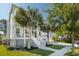 Side angle of a two-story house with a covered porch and lush landscaping at 4082 Blackmoor St, Mount Pleasant, SC 29466