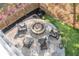 Aerial view of a patio with fire pit, Adirondack chairs, and landscaping at 4082 Blackmoor St, Mount Pleasant, SC 29466