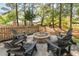 Backyard patio featuring an outdoor fire pit with Adirondack chairs and lush surroundings at 4082 Blackmoor St, Mount Pleasant, SC 29466