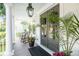 Inviting porch featuring rocking chairs and double doors adorned with wreaths at 4082 Blackmoor St, Mount Pleasant, SC 29466