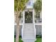Inviting front porch with double doors adorned with wreaths and lush landscaping at 4082 Blackmoor St, Mount Pleasant, SC 29466