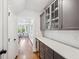 Hallway with cabinetry and serving area leading to the kitchen at 4082 Blackmoor St, Mount Pleasant, SC 29466