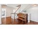 Grand hallway with a piano, hardwood floors, and decorative plants at 4082 Blackmoor St, Mount Pleasant, SC 29466