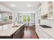Open kitchen with island, stainless steel appliances, and adjacent dining area with ample natural light at 4082 Blackmoor St, Mount Pleasant, SC 29466