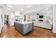 Open-concept kitchen with island, stainless steel appliances, and seamless flow to living area at 4082 Blackmoor St, Mount Pleasant, SC 29466