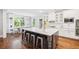 Bright kitchen features a large island with seating, white cabinets, and stainless steel appliances at 4082 Blackmoor St, Mount Pleasant, SC 29466