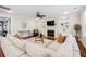 Bright living room with fireplace, built-in shelving, and large sectional sofa at 4082 Blackmoor St, Mount Pleasant, SC 29466