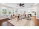 Open-concept living room with a sectional sofa and view into the kitchen at 4082 Blackmoor St, Mount Pleasant, SC 29466
