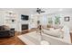 Spacious living room with a fireplace, built-in shelves, and a large window with natural light at 4082 Blackmoor St, Mount Pleasant, SC 29466