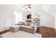 Spacious living room features hardwood floors, a sectional couch, and a ceiling fan at 4082 Blackmoor St, Mount Pleasant, SC 29466