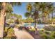 Resort-style pool area with lounge chairs and lush tropical surroundings at 4082 Blackmoor St, Mount Pleasant, SC 29466