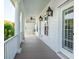 Exterior image of porch with large white columns and hanging lanterns at 4082 Blackmoor St, Mount Pleasant, SC 29466