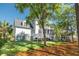 Spacious rear elevation featuring a well-manicured lawn, elevated deck and convenient putting green at 4082 Blackmoor St, Mount Pleasant, SC 29466