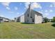 The home features a large grassy backyard, perfect for outdoor activities and relaxation at 409 Thoroughbred Dr, Moncks Corner, SC 29461