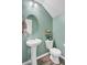 Powder room featuring pedestal sink, modern toilet, and stylish accents at 409 Thoroughbred Dr, Moncks Corner, SC 29461
