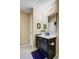 Bathroom featuring a vanity with black cabinets and white countertop, and decorative mirror, and neutral-colored walls at 409 Thoroughbred Dr, Moncks Corner, SC 29461