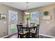 Cozy dining area with a round table and stylish decor near a glass door at 409 Thoroughbred Dr, Moncks Corner, SC 29461