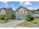 A charming house with a two-car garage and beautiful front yard landscaping at 409 Thoroughbred Dr, Moncks Corner, SC 29461