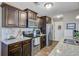 Modern kitchen showcasing granite countertops, stainless steel appliances, and rich wood cabinetry at 409 Thoroughbred Dr, Moncks Corner, SC 29461