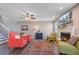 Comfortable living room with a fireplace and plenty of natural light at 409 Thoroughbred Dr, Moncks Corner, SC 29461