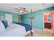 Comfortable Primary bedroom featuring four-poster bed, and access to ensuite bathroom at 409 Thoroughbred Dr, Moncks Corner, SC 29461