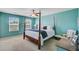 Inviting bedroom with a four-poster bed, soft carpet, and a ceiling fan for added comfort at 409 Thoroughbred Dr, Moncks Corner, SC 29461