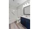 Well-lit bathroom featuring a new vanity, and shower-tub combination with safety bar at 415 Parkdale Dr # 2B, Charleston, SC 29414