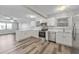 Spacious kitchen featuring stainless steel appliances, white cabinetry, and ample counter space at 415 Parkdale Dr # 2B, Charleston, SC 29414