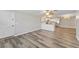 Open floor plan view of living room flowing into kitchen with stainless steel appliances at 415 Parkdale Dr # 2B, Charleston, SC 29414