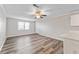 Bright living room featuring wood-look flooring, a ceiling fan, and a window with blinds at 415 Parkdale Dr # 2B, Charleston, SC 29414