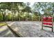 Community playground and play structure for outdoor fun with swings, slide, and tic-tac-toe board at 415 Parkdale Dr # 2B, Charleston, SC 29414