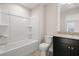 Bright bathroom with a shower-tub combo and granite countertop vanity at 4996 Song Sparrow Way, Summerville, SC 29483