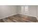 Bedroom with hardwood floors, neutral paint, and French doors leading to another room at 4996 Song Sparrow Way, Summerville, SC 29483