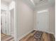 An inviting entryway with hardwood floors, neutral walls, and stylish rug at 4996 Song Sparrow Way, Summerville, SC 29483