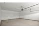 A spacious two car garage with concrete flooring and white walls at 4996 Song Sparrow Way, Summerville, SC 29483