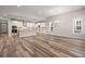 Modern kitchen with stainless steel appliances, white cabinets, and an open-concept layout at 4996 Song Sparrow Way, Summerville, SC 29483