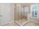 Elegant bathroom featuring a glass-enclosed shower with tiled walls and a modern showerhead at 4996 Song Sparrow Way, Summerville, SC 29483