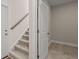 Carpeted staircase with wooden handrail leading to the next level at 4996 Song Sparrow Way, Summerville, SC 29483