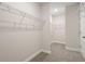 Spacious walk-in closet with ample shelving and carpet flooring at 4996 Song Sparrow Way, Summerville, SC 29483