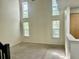 Expansive room with tall vaulted ceilings, carpet, and several windows offering natural light at 5226 Fernland Way, North Charleston, SC 29420