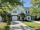 Charming home with a one-car garage and well-maintained lawn and a sidewalk that leads to the main driveway at 5226 Fernland Way, North Charleston, SC 29420