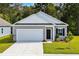 Charming single-story home featuring a two-car garage, manicured lawn, and inviting front entrance at 544 Pender Woods Dr, Summerville, SC 29486
